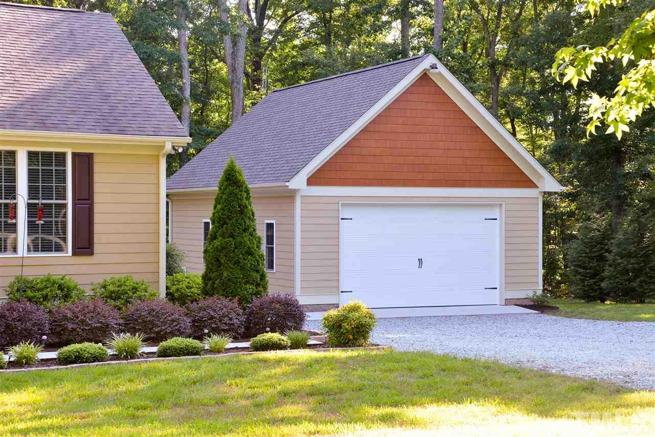 201 Weaver Ridge Road Rougemont, NC 27572 - Photo 4 of 25 a front view of house with yard and green space