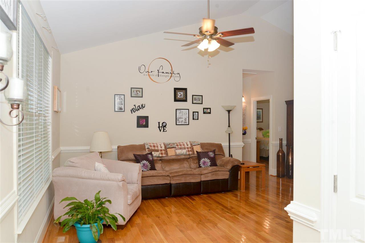 201 Weaver Ridge Road Rougemont, NC 27572 - Photo 7 of 25 a living room with furniture chandelier and a chandelier