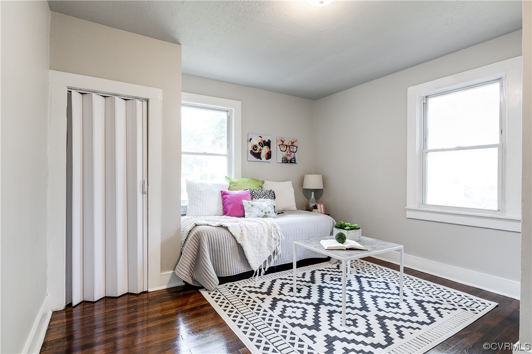 5436 Snead Road Richmond, VA 23224 - Photo 14 of 22 a bed sitting in a bedroom next to a window