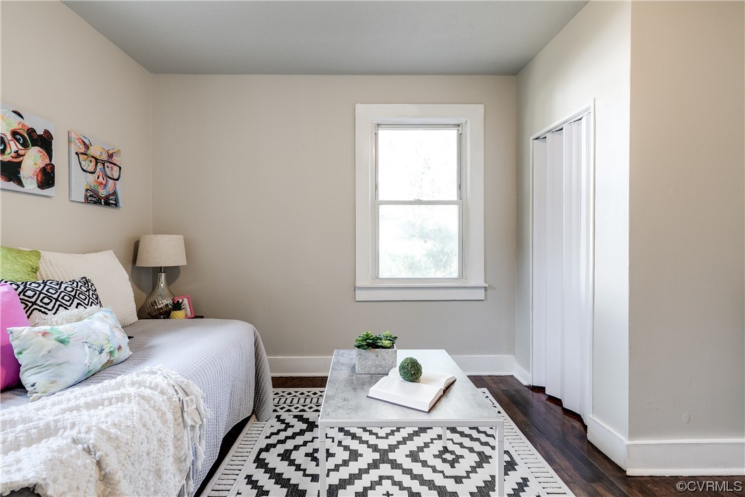 5436 Snead Road Richmond, VA 23224 - Photo 15 of 22 a bedroom with a bed and wooden floor