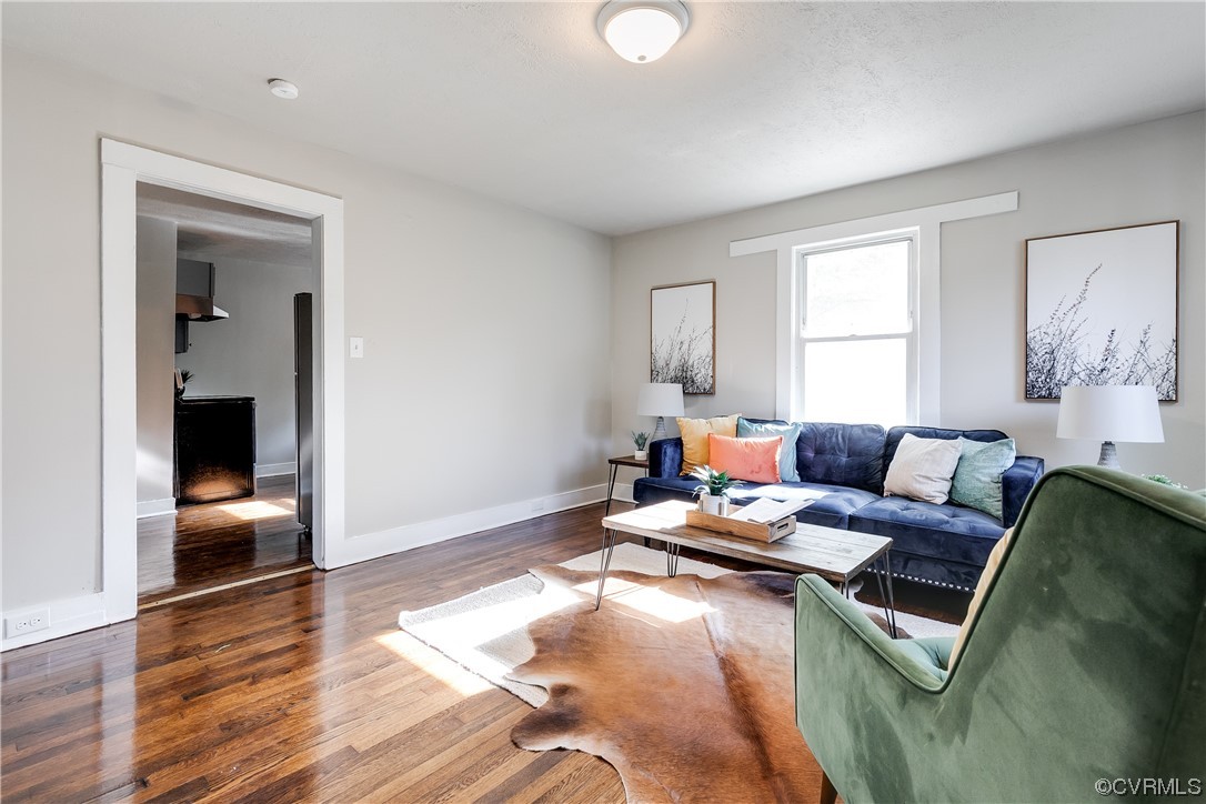 5436 Snead Road Richmond, VA 23224 - Photo 4 of 22 a living room with furniture and a wooden floor