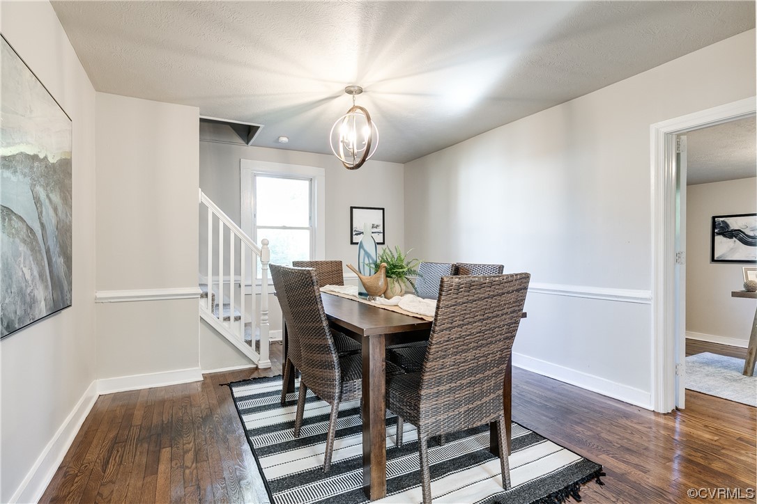5436 Snead Road Richmond, VA 23224 - Photo 7 of 22 a view of a dining room with furniture wooden floor and chandelier
