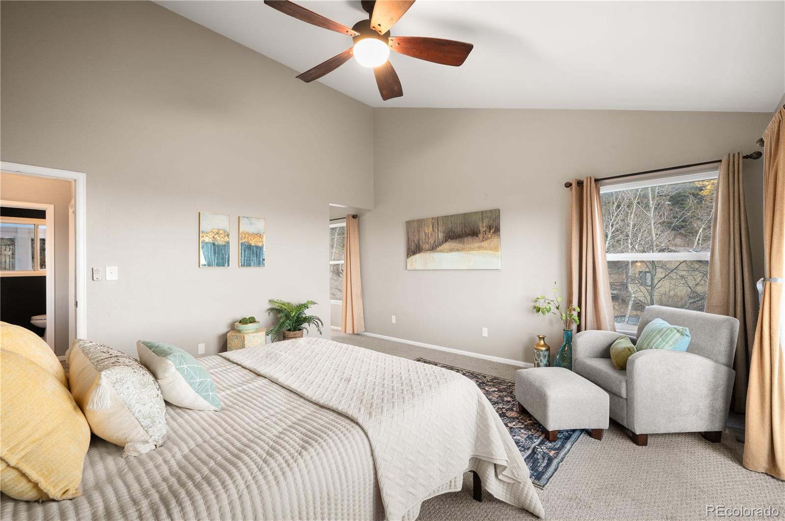 11740 Baca Road Conifer, CO 80433 - Photo 36 of 49 a bedroom with bed and a large window
