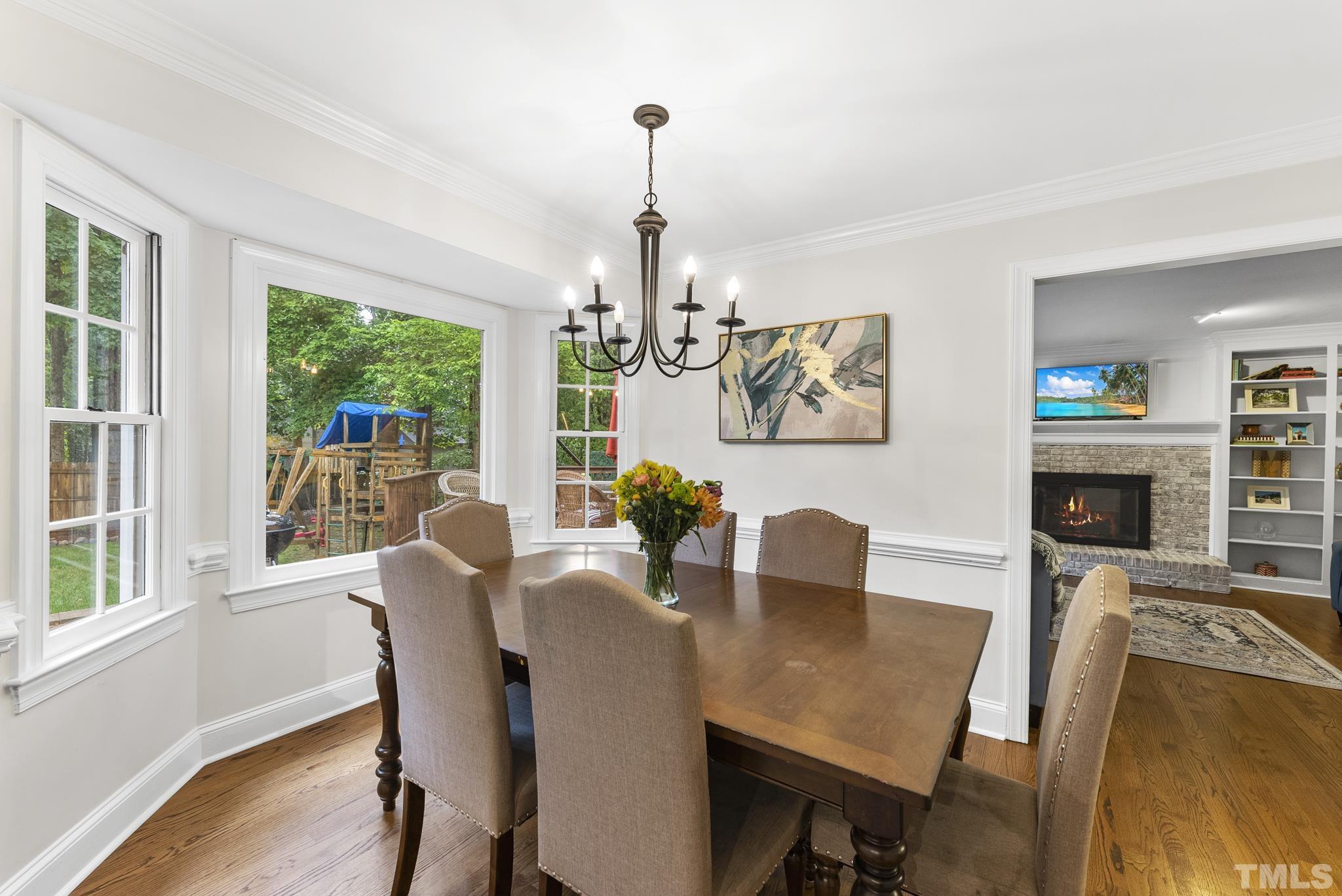 8304 Apple Orchard Way Raleigh, NC 27615 - Photo 11 of 36 a view of a dining room with furniture window and outside view