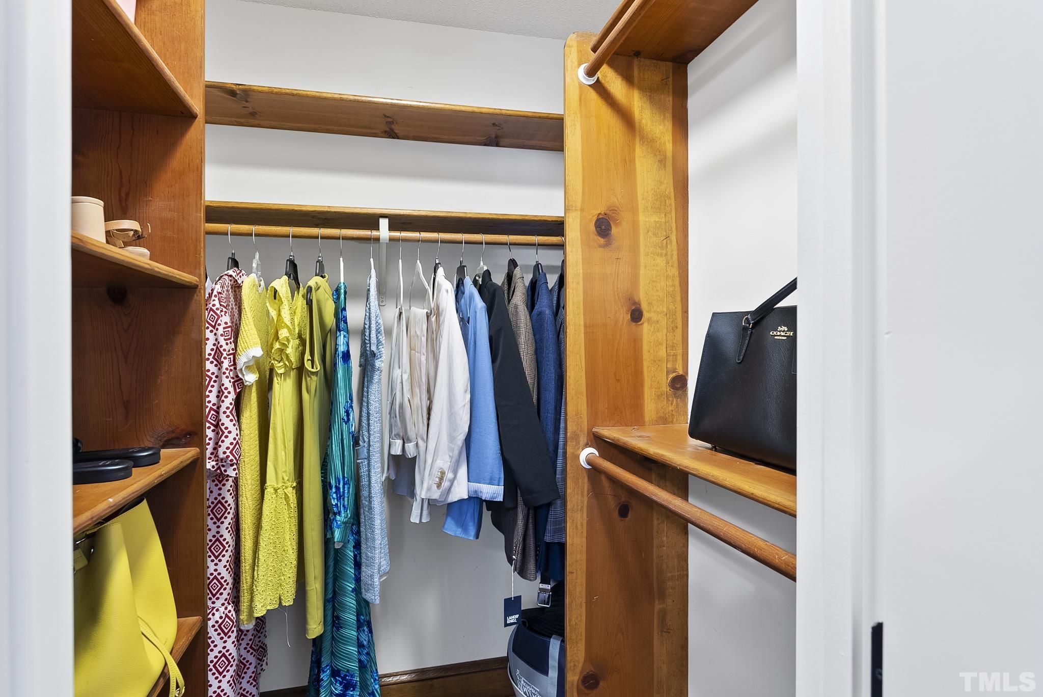 8304 Apple Orchard Way Raleigh, NC 27615 - Photo 23 of 36 a view of walk in closet with clothes and shoes