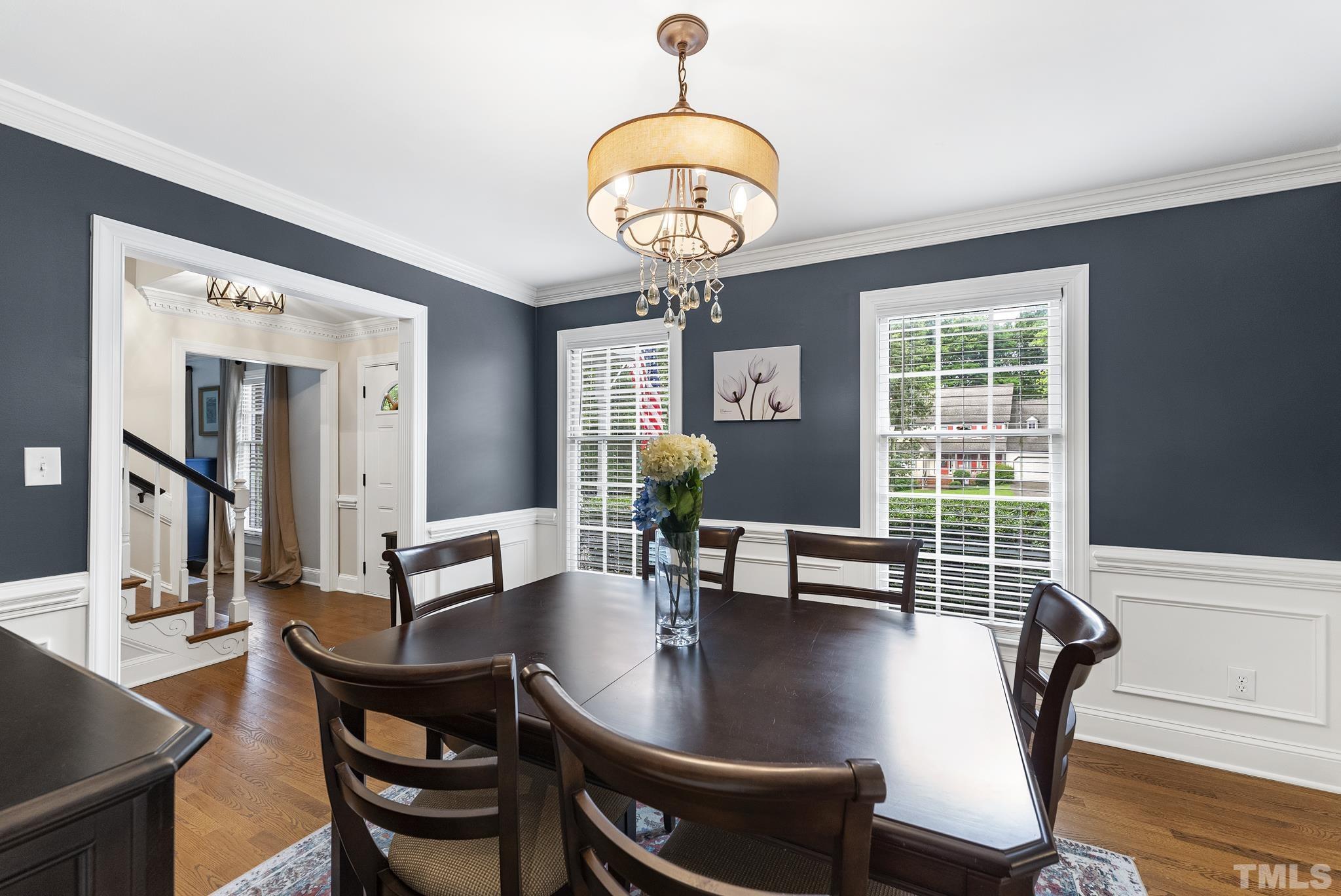 8304 Apple Orchard Way Raleigh, NC 27615 - Photo 5 of 36 a dining room with furniture and wooden floor