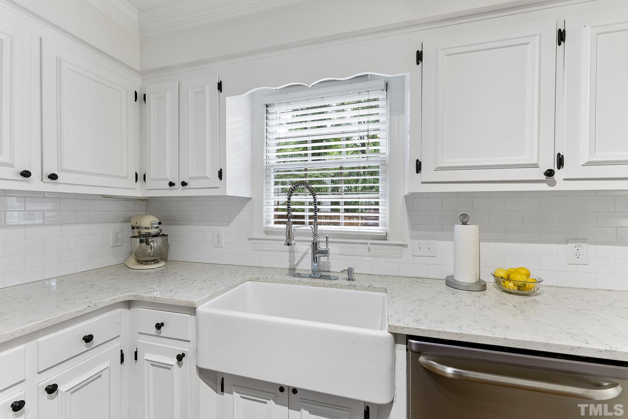 8304 Apple Orchard Way Raleigh, NC 27615 - Photo 8 of 36 a kitchen with a sink cabinets and window