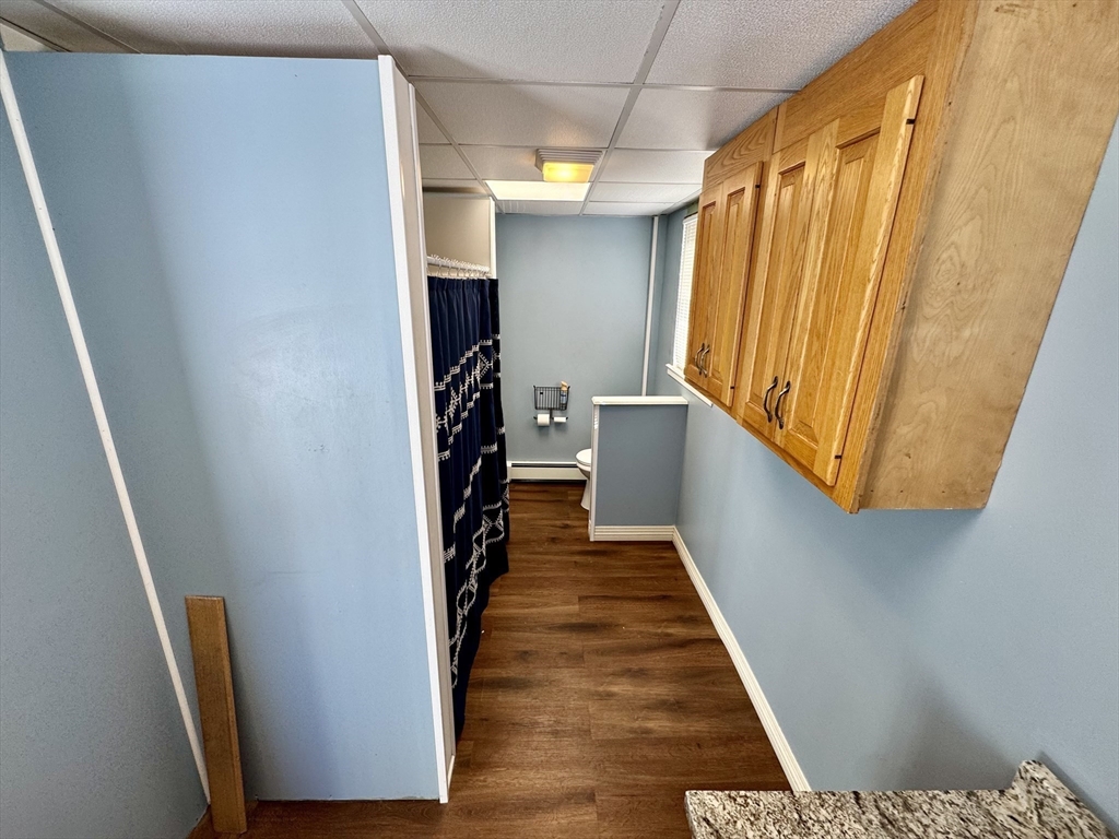 30 Broad Street Fall River, MA 02724 - Photo 11 of 31 a view of entryway with wooden floor and stairs