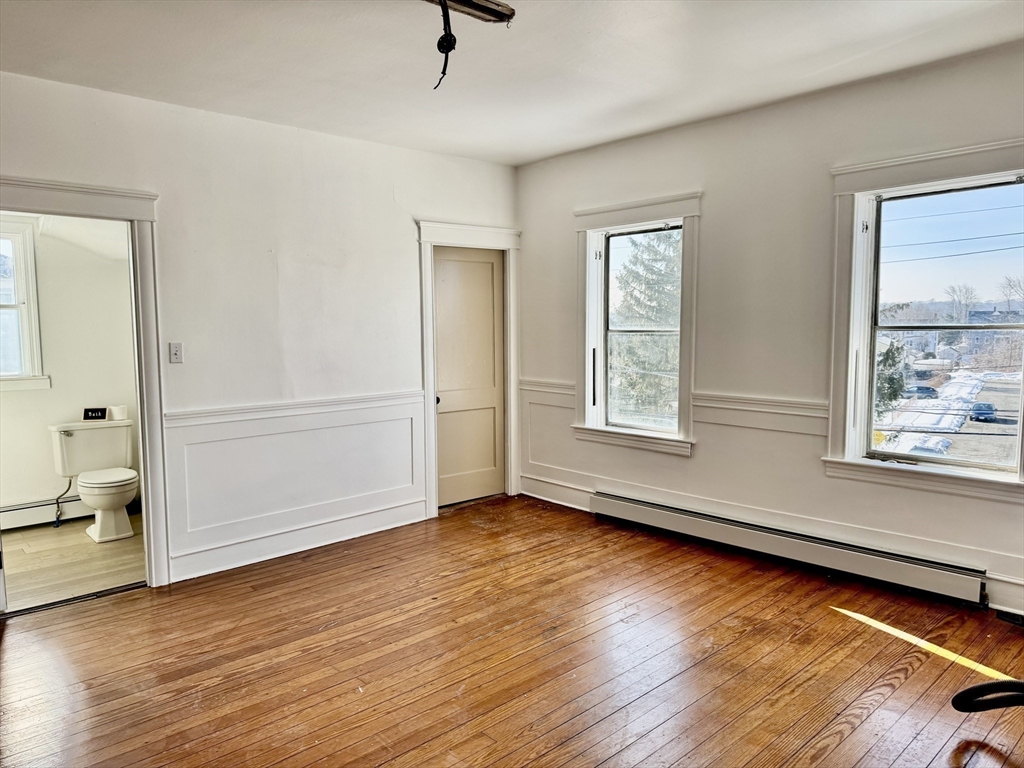 30 Broad Street Fall River, MA 02724 - Photo 20 of 31 wooden floor in an empty room with a window
