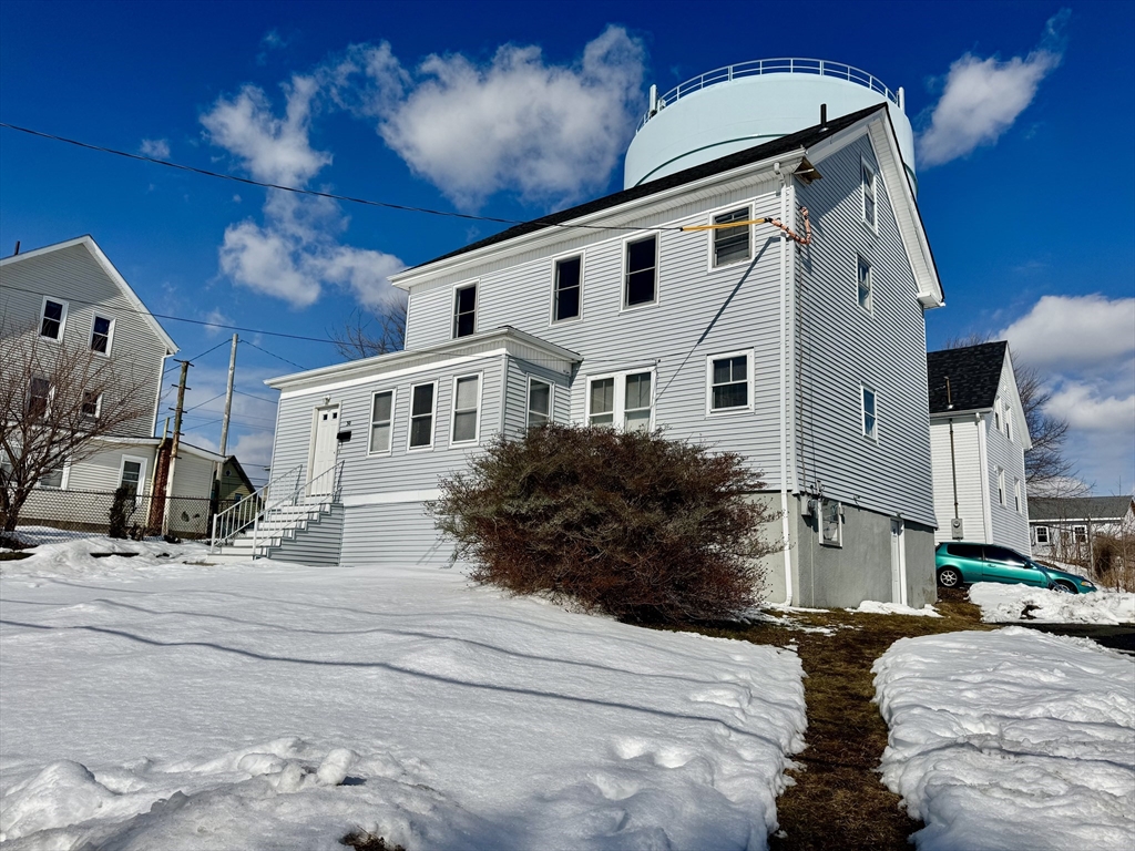 30 Broad Street Fall River, MA 02724 - Photo 2 of 31 a front view of a house with a yard