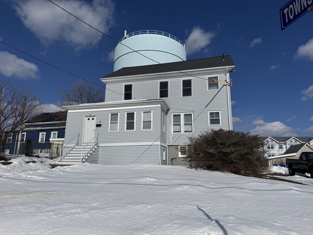 30 Broad Street Fall River, MA 02724 - Photo 3 of 31 a front view of a house with a yard