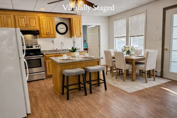 a view of a dining room with furniture and window