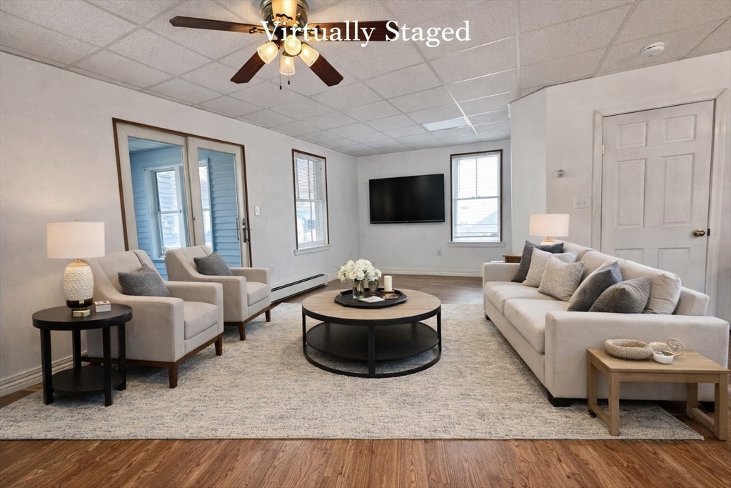 30 Broad Street Fall River, MA 02724 - Photo 9 of 31 a living room with furniture and a flat screen tv