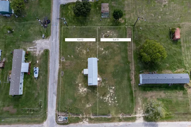 aerial view of a house with a yard