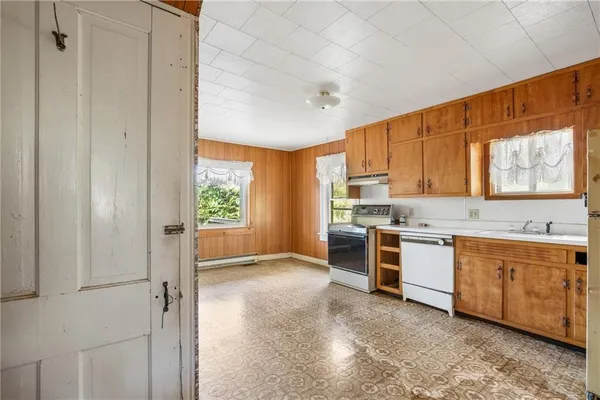 a kitchen with stainless steel appliances granite countertop a stove and a refrigerator