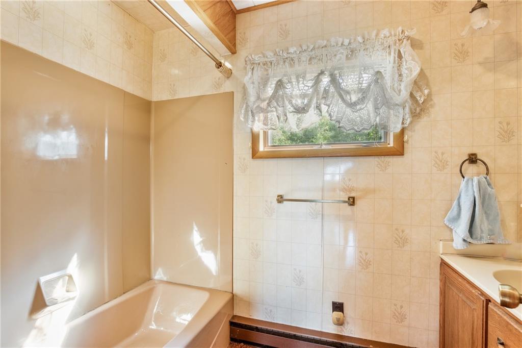 671 Hauger Road Rockwood, PA 15557 - Photo 14 of 39 a bathroom with a tub and sink