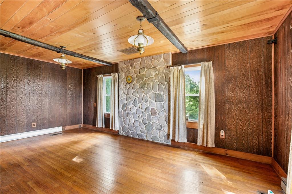671 Hauger Road Rockwood, PA 15557 - Photo 15 of 39 an empty room with wooden floor and windows