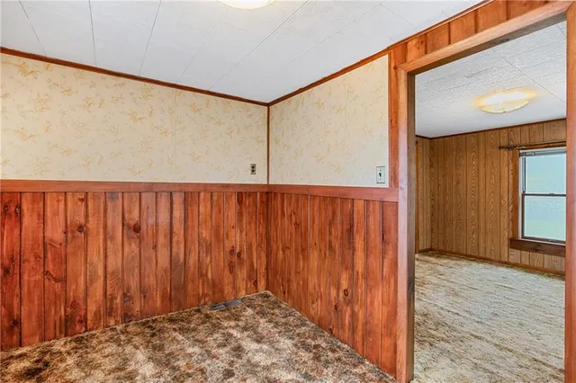a view of a porch with wooden floor and stairs