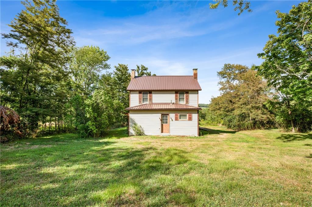 671 Hauger Road Rockwood, PA 15557 - Photo 28 of 39 a front view of a house with a yard