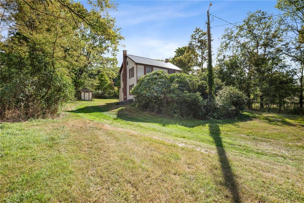 671 Hauger Road Rockwood, PA 15557 - Photo 3 of 39 a backyard of a house with lots of green space