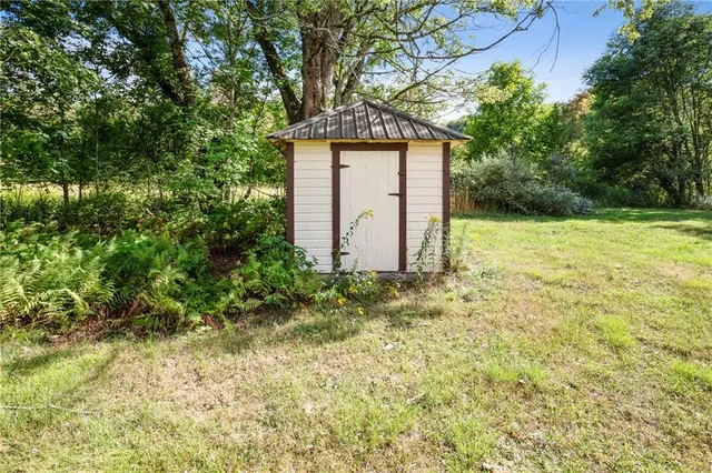 a backyard of a house with lots of green space