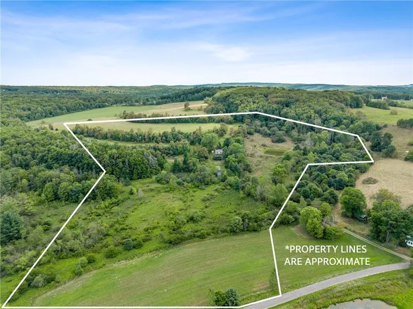 a aerial view of a house with a yard