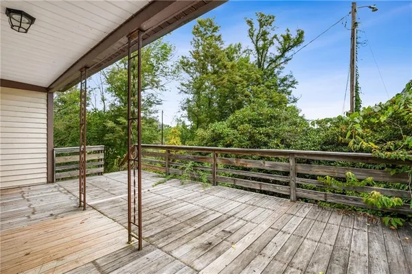 a view of outdoor space with deck and yard