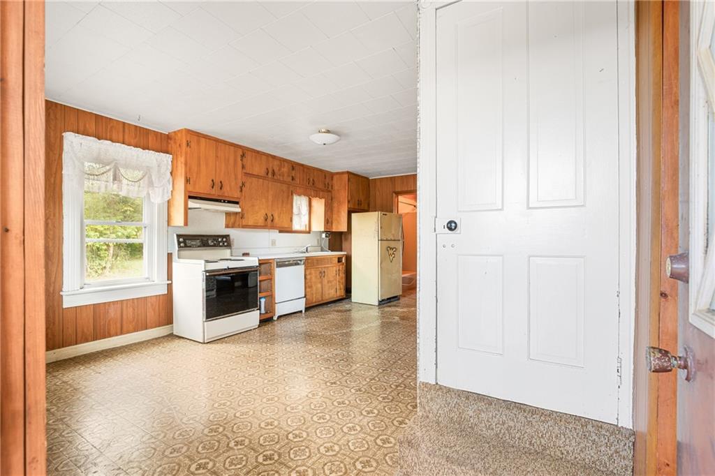671 Hauger Road Rockwood, PA 15557 - Photo 9 of 39 a kitchen with stainless steel appliances a refrigerator and a stove top oven