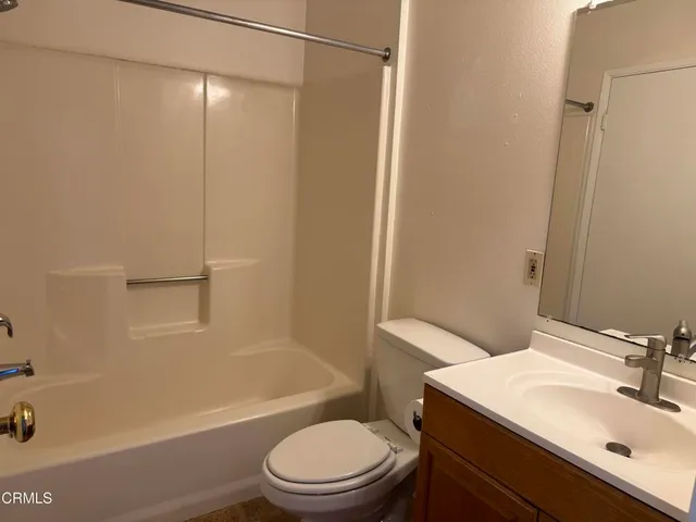 a bathroom with a sink a toilet and a bathtub