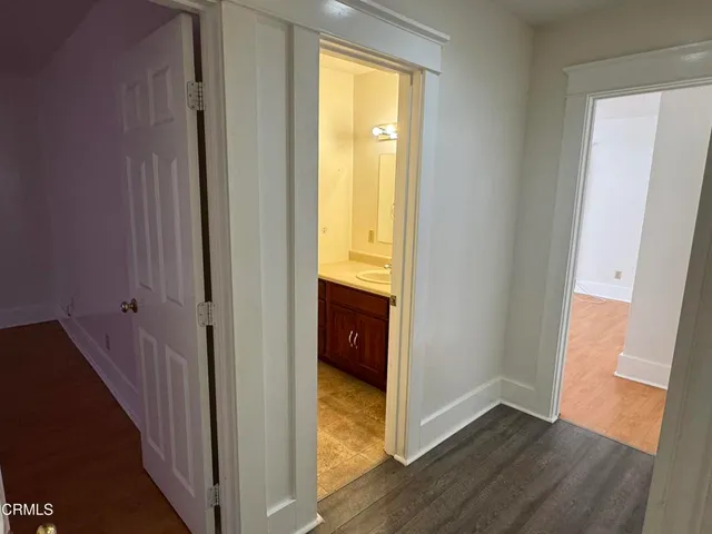 a bathroom with a sink double vanity granite tub shower and a mirror