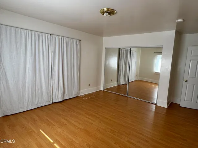 a view of a house with a wooden deck