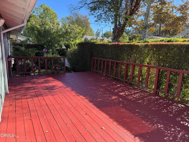 a backyard of a house with yard and outdoor seating