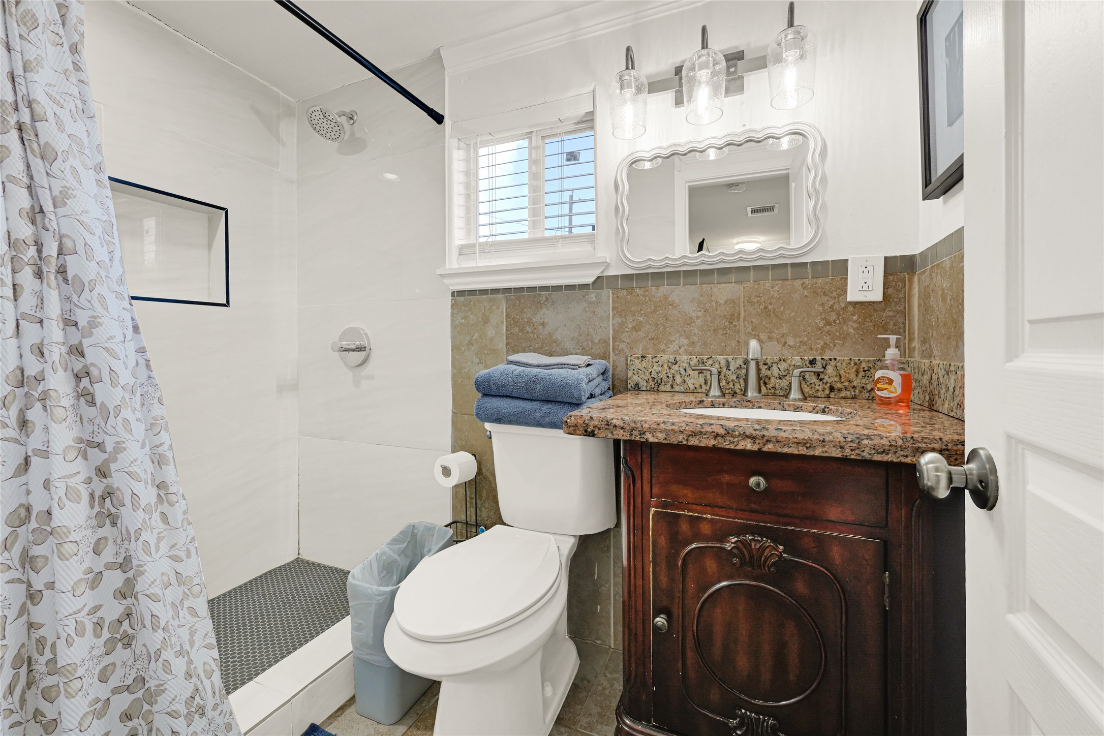 2809 Tooke Street Houston, TX 77023 - Photo 42 of 50 a bathroom with a sink toilet and shower