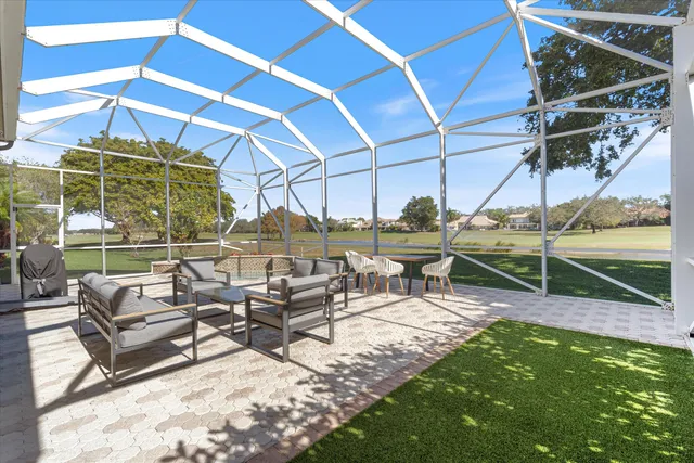 a view of a swimming pool with a lounge chair