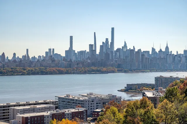 a view of a city with a lake