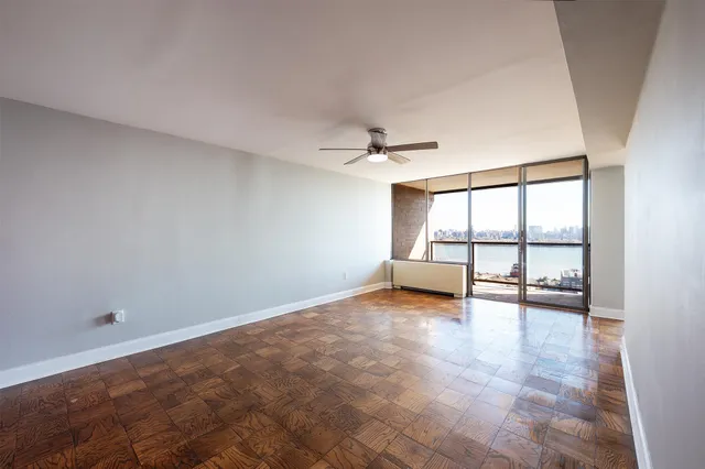 a view of an empty room with a window
