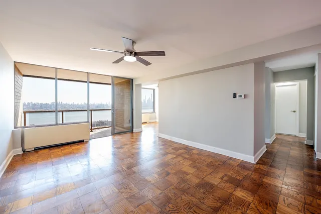 a view of an empty room with a window
