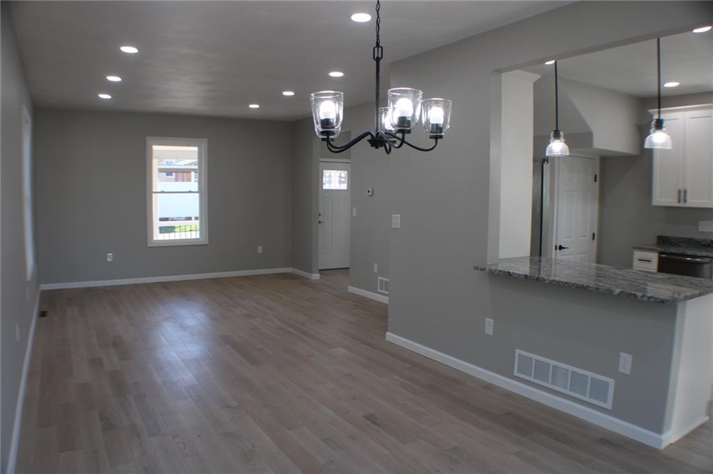 583 Clark Street Indiana, PA 15701 - Photo 17 of 40 View of the living room with recessed lighting, hardwood floors, and freshly painted walls.