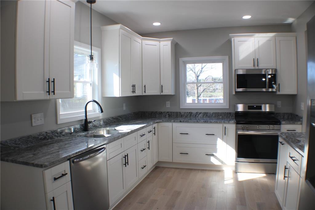 583 Clark Street Indiana, PA 15701 - Photo 5 of 40 This is a kitchen everyone will love with stainless steel appliances, soft close drawers, beautiful granite, a garbage disposal, and white cabinets.