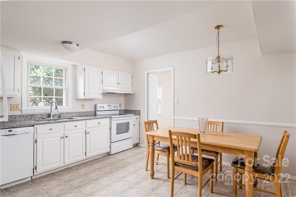 6777 Stoney Ridge Road Matthews, NC 28104 - Photo 11 of 27 a view of a dining room with furniture and window