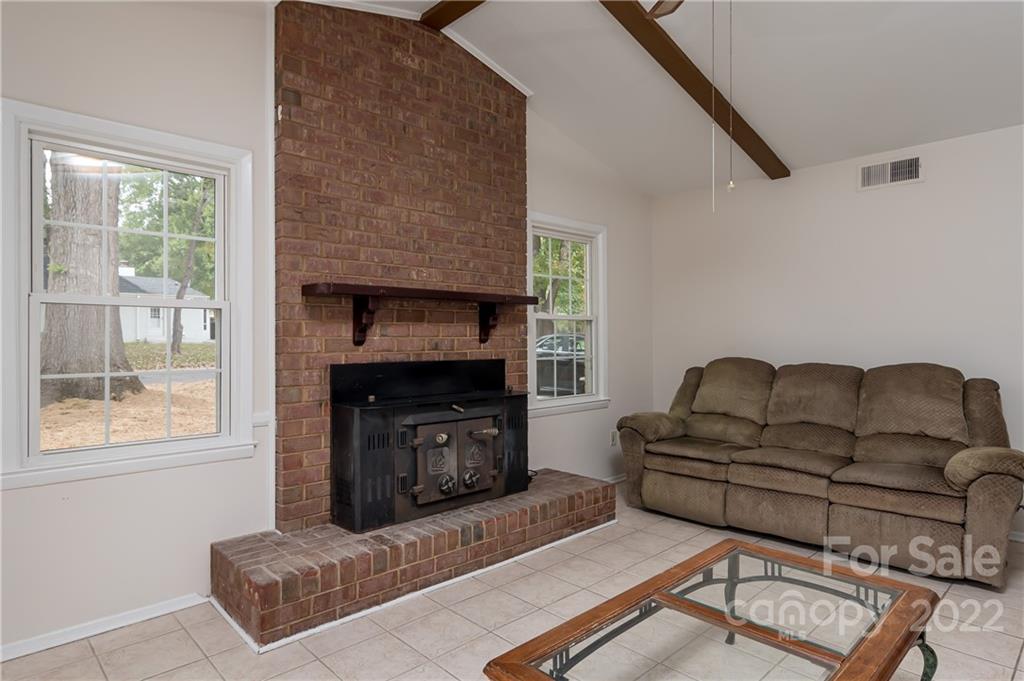 6777 Stoney Ridge Road Matthews, NC 28104 - Photo 14 of 27 a living room with furniture and a fireplace