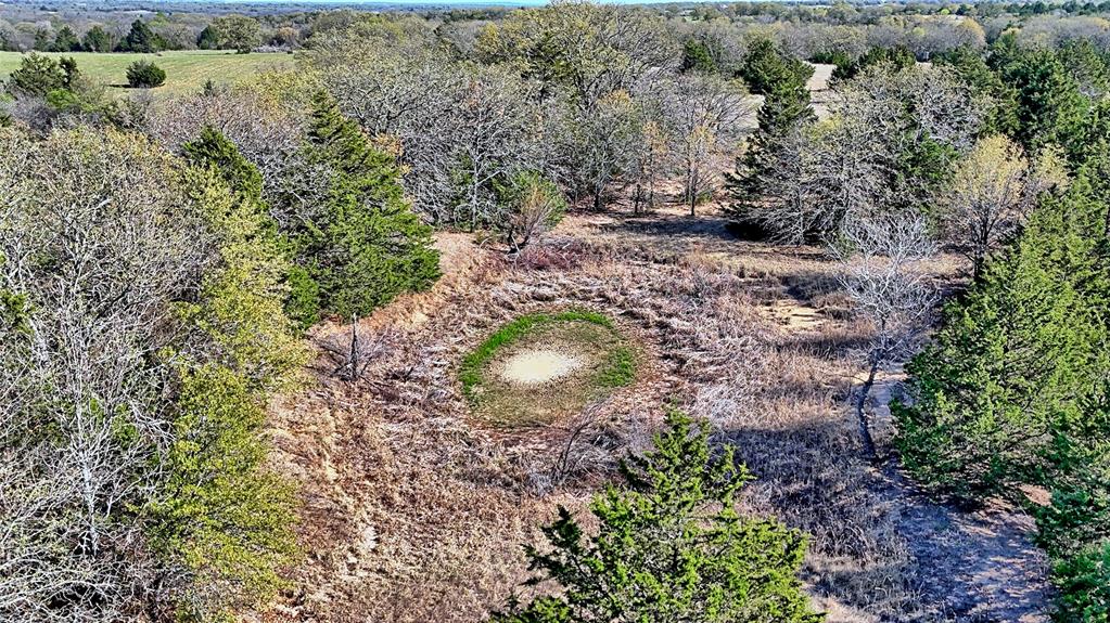 Tbd Cole Road Bowie, TX 76230 - Photo 12 of 27 a aerial view of a house with a yard and large trees