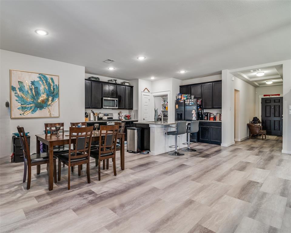 4204 Bullock Lane Forney, TX 75126 - Photo 13 of 25 a view of a kitchen and dining room