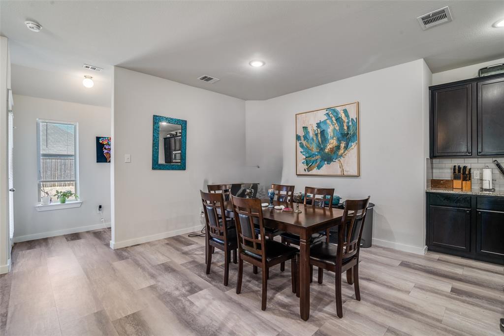 4204 Bullock Lane Forney, TX 75126 - Photo 14 of 25 a view of a dining room with furniture window and wooden floor