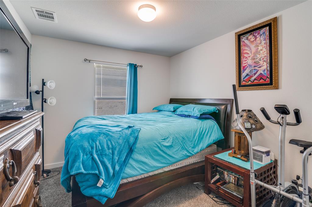 4204 Bullock Lane Forney, TX 75126 - Photo 15 of 25 a bedroom with bed and a window