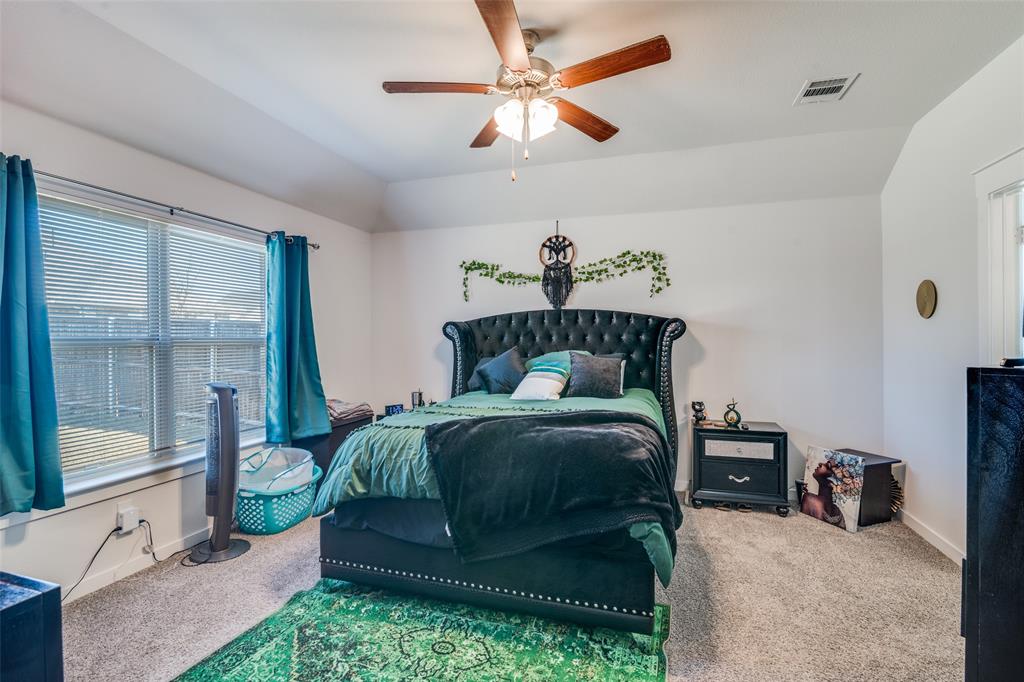 4204 Bullock Lane Forney, TX 75126 - Photo 18 of 25 a bedroom with a bed and a large window