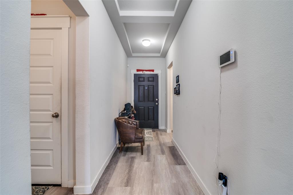 4204 Bullock Lane Forney, TX 75126 - Photo 2 of 25 a view of a hallway to a livingroom with furniture