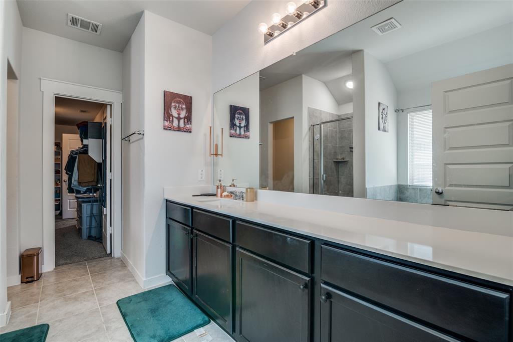 4204 Bullock Lane Forney, TX 75126 - Photo 22 of 25 a bathroom with a sink and a mirror