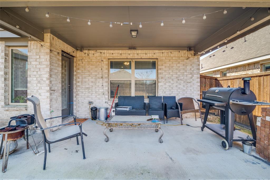 4204 Bullock Lane Forney, TX 75126 - Photo 24 of 25 a living room with furniture and a window