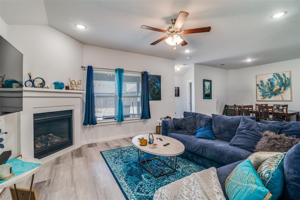 4204 Bullock Lane Forney, TX 75126 - Photo 6 of 25 a living room with furniture and a fireplace
